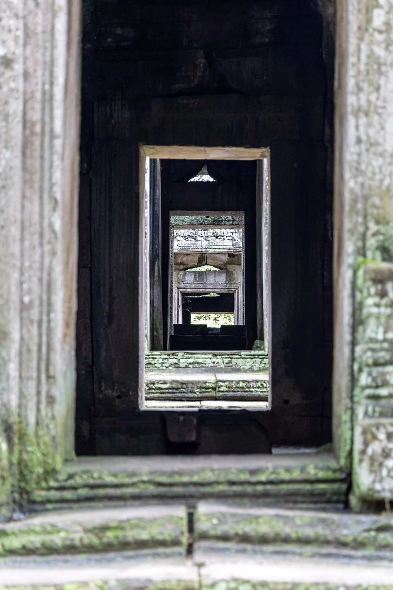 A sequence of stone doorways receding into the distance.