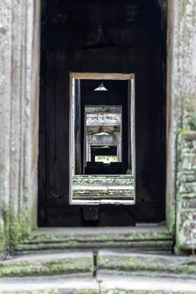 A sequence of stone doorways receding into the distance.