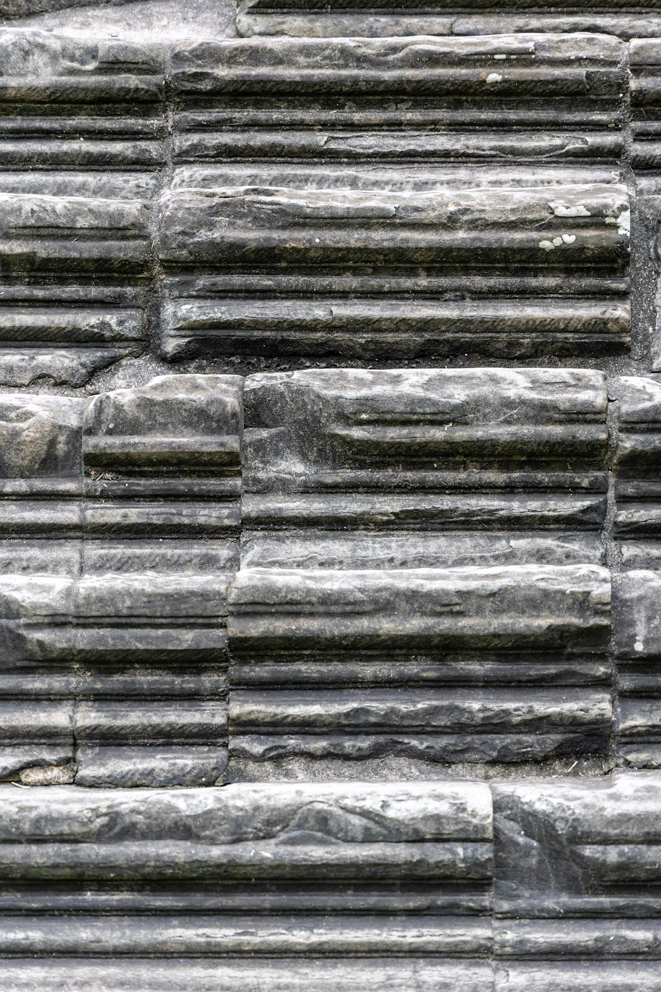 The worn edges and repeating patterns of ancient stone steps.